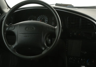 Подержанный автомобиль Kia Spectra Sedan 2008 года (14 фото)