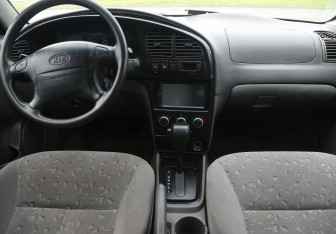 Подержанный автомобиль Kia Spectra Sedan 2009 года (12 фото)