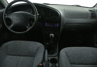 Подержанный автомобиль Kia Spectra Sedan 2008 года (12 фото)