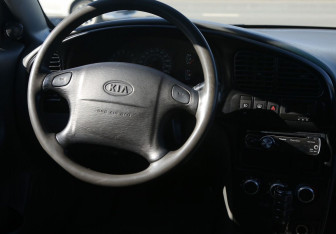 Подержанный автомобиль Kia Spectra Sedan 2007 года (14 фото)