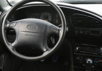 Подержанный автомобиль Kia Spectra Sedan 2007 года (14 фото)