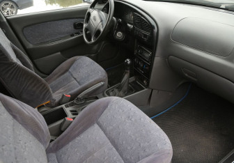 Подержанный автомобиль Kia Spectra Sedan 2007 года (9 фото)