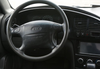 Подержанный автомобиль Kia Spectra Sedan 2009 года (14 фото)
