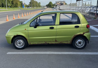 Подержанный автомобиль Daewoo Matiz 2012 года (7 фото)