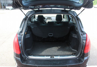 Подержанный автомобиль Peugeot 308 Wagon 2010 года (15 фото)
