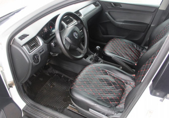 Подержанный автомобиль Skoda Rapid Liftback 2015 года (10 фото)