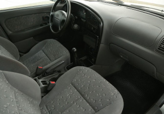 Подержанный автомобиль Kia Spectra Sedan 2008 года (9 фото)