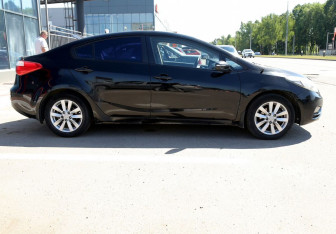 Подержанный автомобиль Kia Cerato Sedan 2013 года (7 фото)