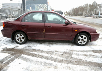 Подержанный автомобиль Kia Spectra Sedan 2006 года (7 фото)