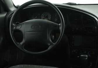 Подержанный автомобиль Kia Spectra Sedan 2008 года (14 фото)