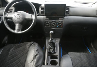 Подержанный автомобиль Toyota Corolla Sedan 2004 года (12 фото)