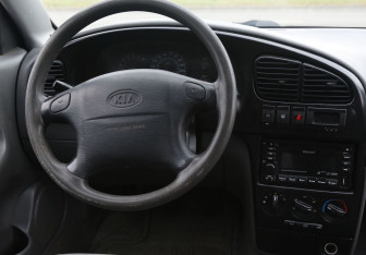 Подержанный автомобиль Kia Spectra Sedan 2008 года (14 фото)