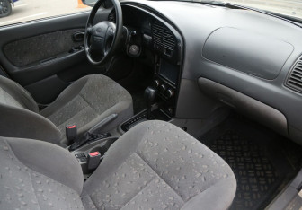 Подержанный автомобиль Kia Spectra Sedan 2009 года (9 фото)