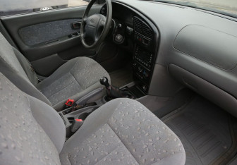 Подержанный автомобиль Kia Spectra Sedan 2008 года (9 фото)