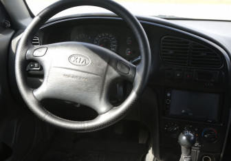 Подержанный автомобиль Kia Spectra Sedan 2007 года (14 фото)