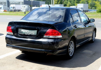 Подержанный автомобиль Mitsubishi Lancer Sedan 2006 года (6 фото)